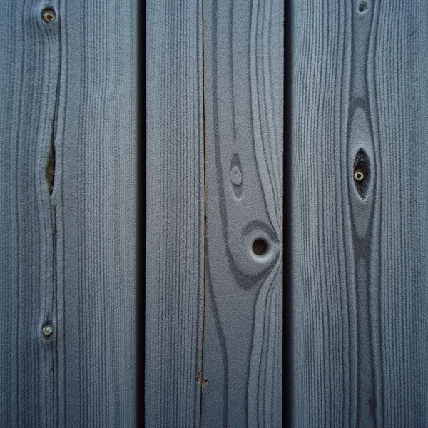 Frost coating the grain of weathered wooden planks