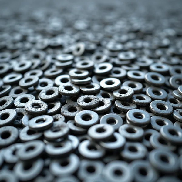 A loose pile of plain steel flat washers filling the frame